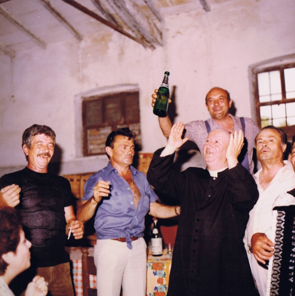 Historical photo of the day: priest having fun with locals in Casale Monticchio.