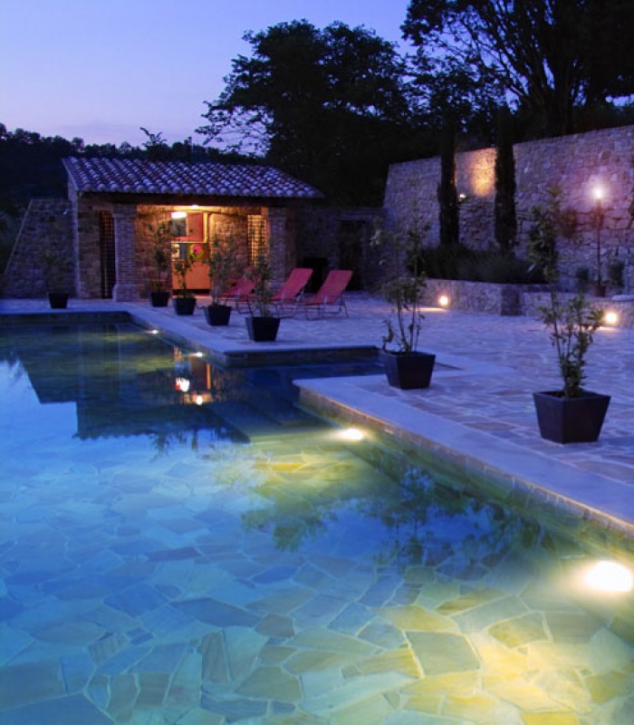 Terrace and swimming pool by night