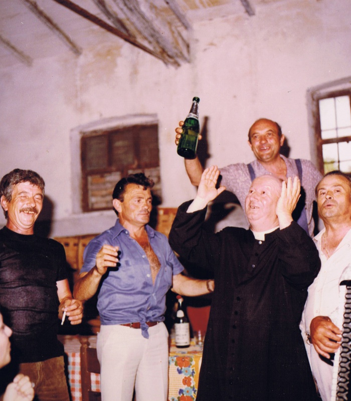Historical photo of the day: priest having fun with locals in Casale Monticchio.