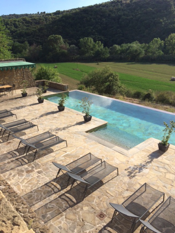 External swimming pool with stunning view of the hills around